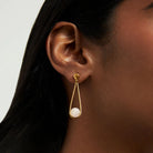 moonstone earrings on someone