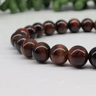 Red Tiger Eye 8mm Smooth Bead Stretch Bracelet Up Close