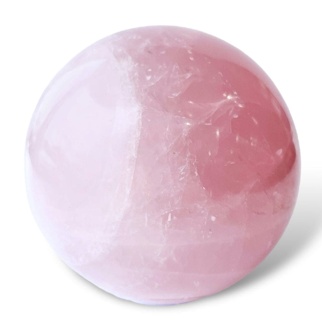 Pink Rose Quartz Crystal ball on a white background