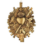 Decorative gold emblem with heart and cross design on a white background