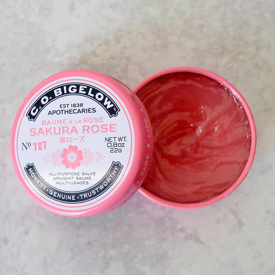 Pink jar of C.O. Bigelow Sakura Rose salve on a light gray background