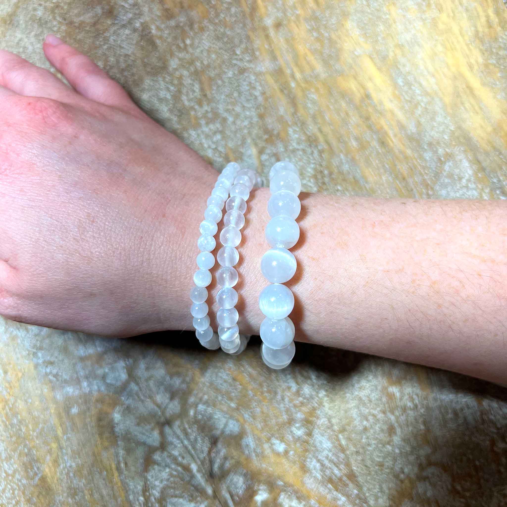 Selenite Bracelet on arm set of 3 different size selenite bead bracelets