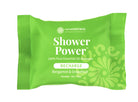 Green packaging of Shower Power essential oil steamers with branding on a white background