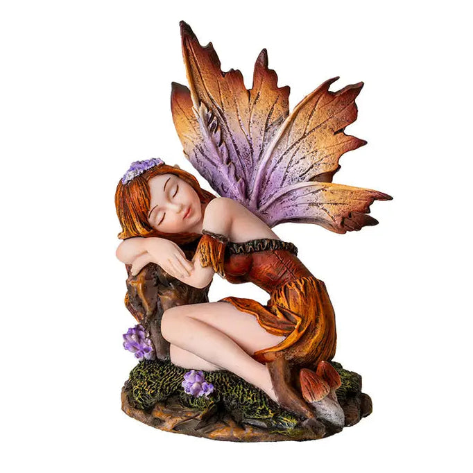 Garden fairy figurine with leaf wings on a white background