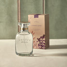 Sienna Sage Eau de Parfum with a light green background