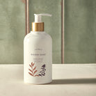 Sienna Sage Hand Lotion with a light green background