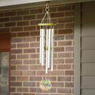 Rainbow Tree of Life Chime Against Brick Wall