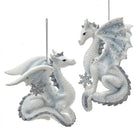 Two dragon-shaped ornaments with snowflake details on a white background