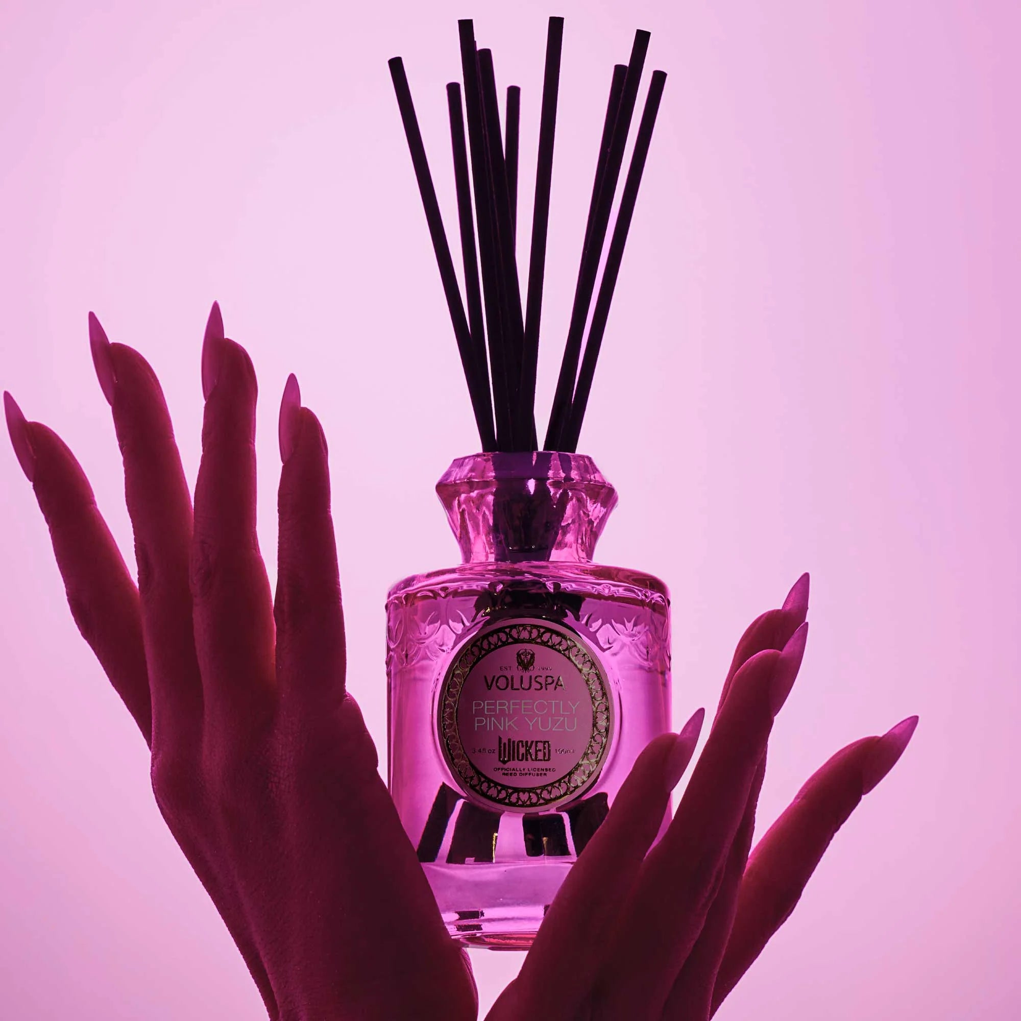 Glinda’s Perfectly Pink Yuzu Reed Diffuser (Wicked Collection) with hands