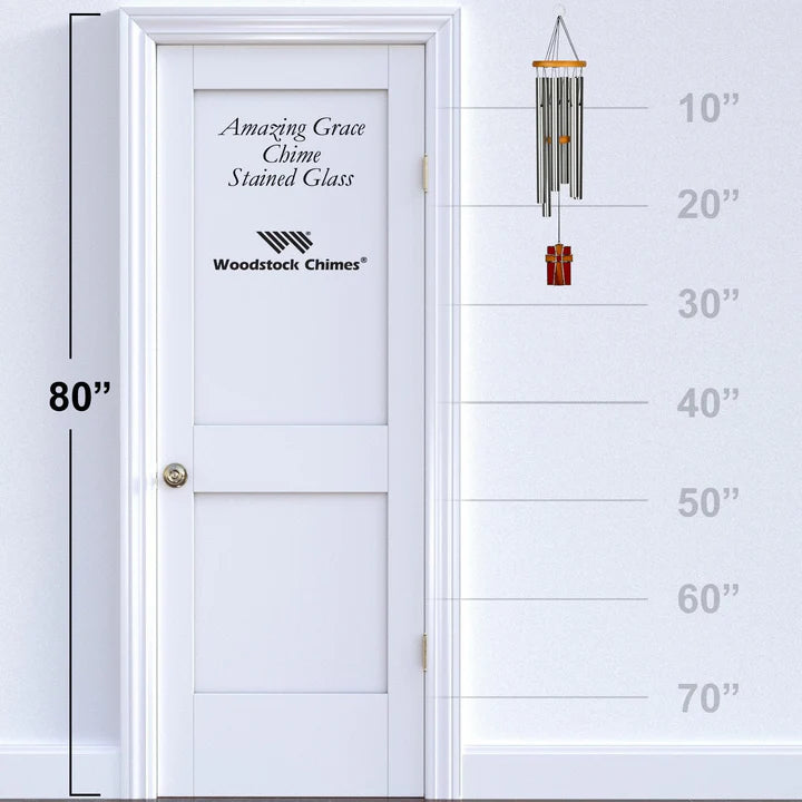 Woodstock Chimes Amazing Grace Chime Stained Glass against a white door with measurement scale