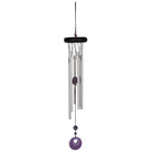 Decorative wind chime with purple accents on a white background