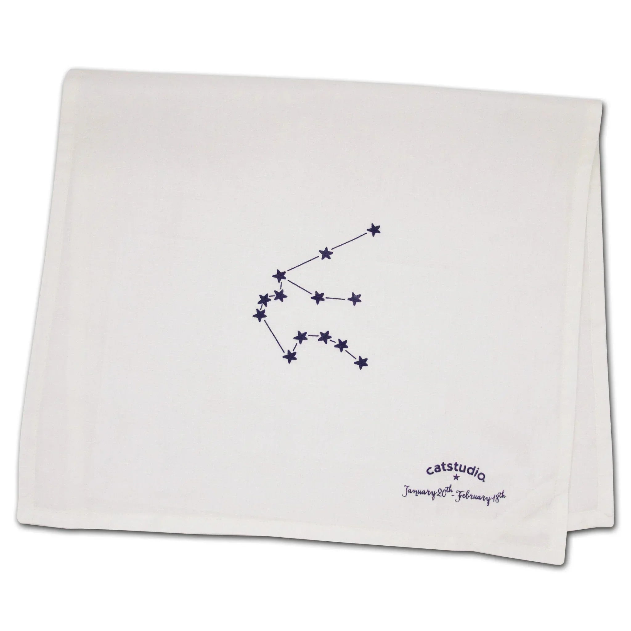 White towel with star constellation design and 'catstudio' branding on a white background