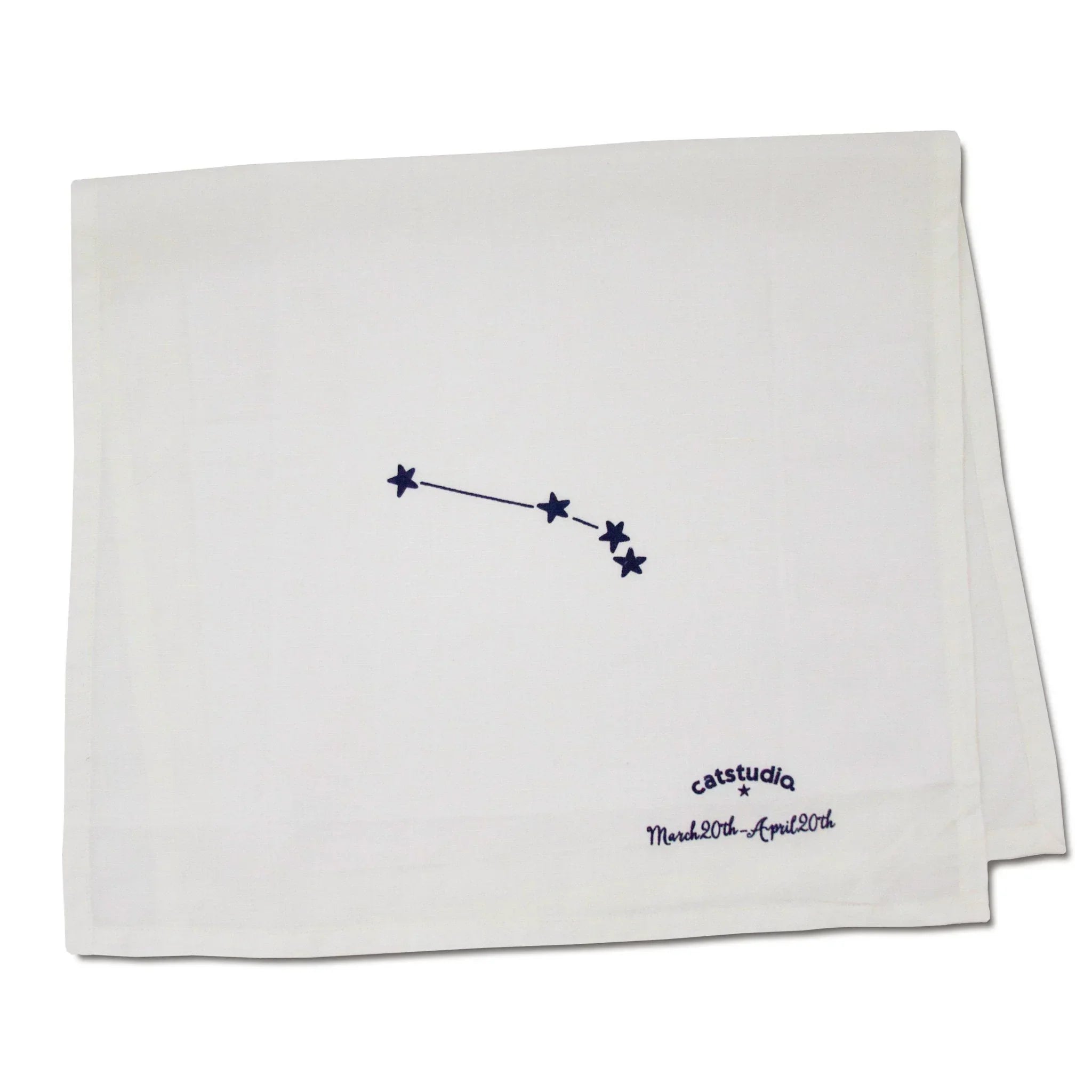 White towel with embroidered star constellation design and text on a white background