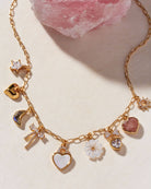 gold charm necklace with stone