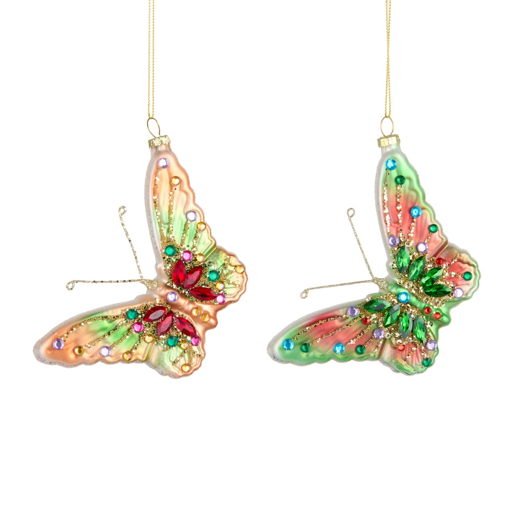 Two colorful butterfly ornaments with gemstones on a white background