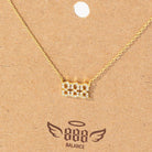 Gold necklace on a brown card with '888 Balance' branding