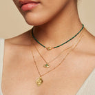 Embraced in Protection Emerald Hamsa Pendant Necklace layered