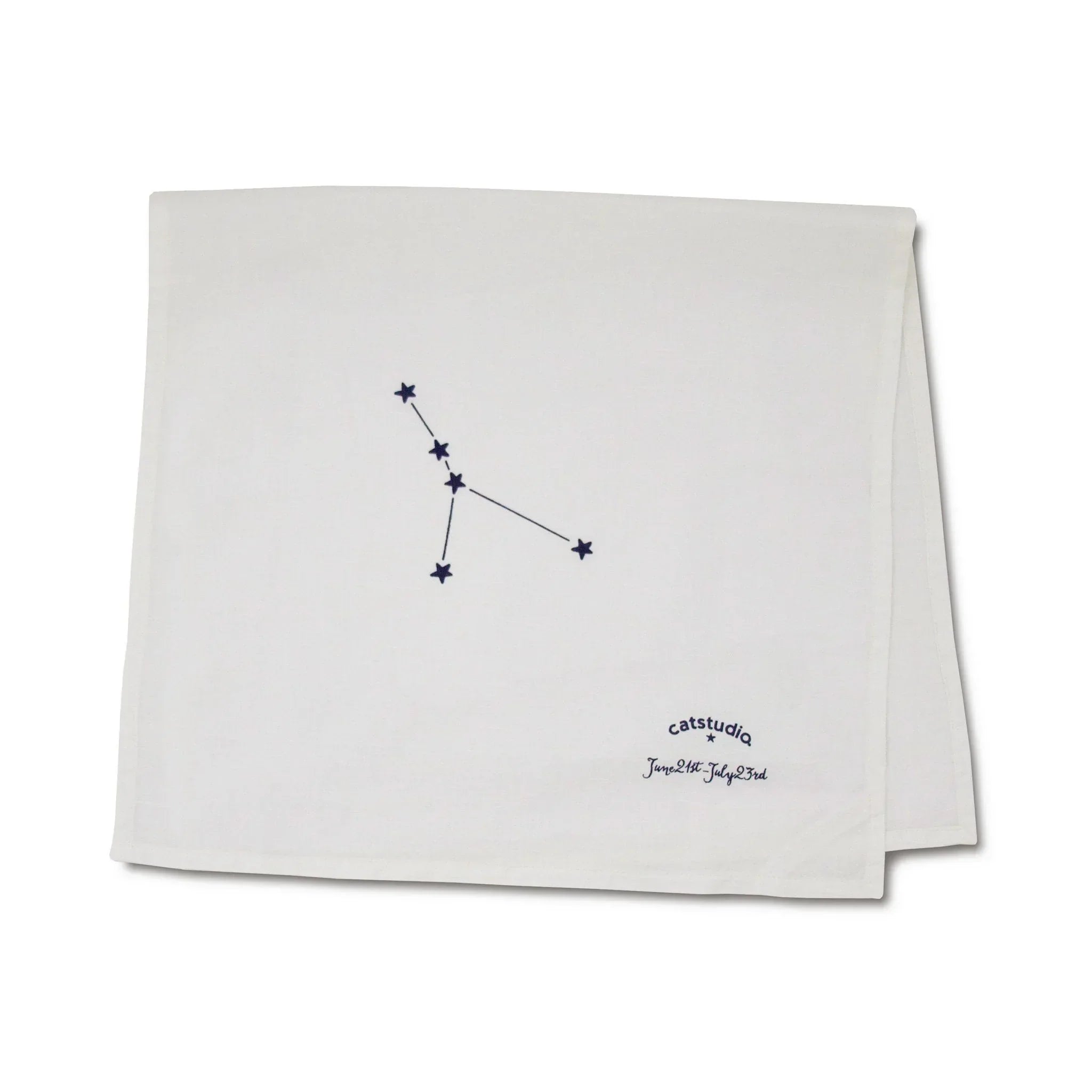 Folded white towel with a black constellation design and text on a white background