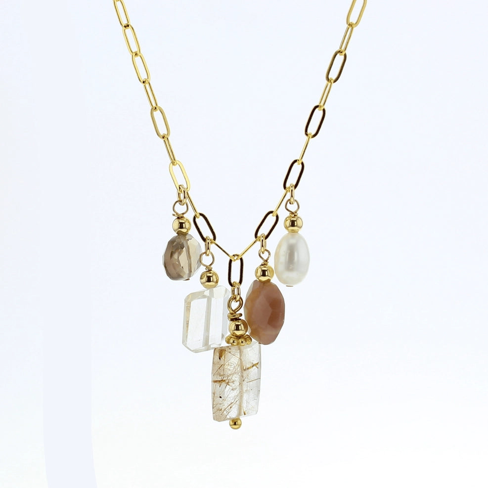 A gold chain necklace featuring a multi-stone pendant with a white pearl, a rectangular rutilated quartz  clear stone, a brown stone, and a vertical clear rectangle stone with gold inclusions, set against a plain white background.