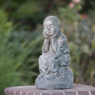 Serene Shaolin Monk Sitting on Stone