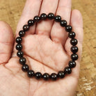 Garnet gemstone bracelet in hand