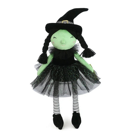 Plush toy dressed as a witch with green face, black hat, and black and white striped stockings on a white background.