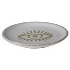 Ceramic plate with an eye design on a white background