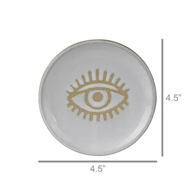 Round ceramic dish with eye design and measurements on a white background