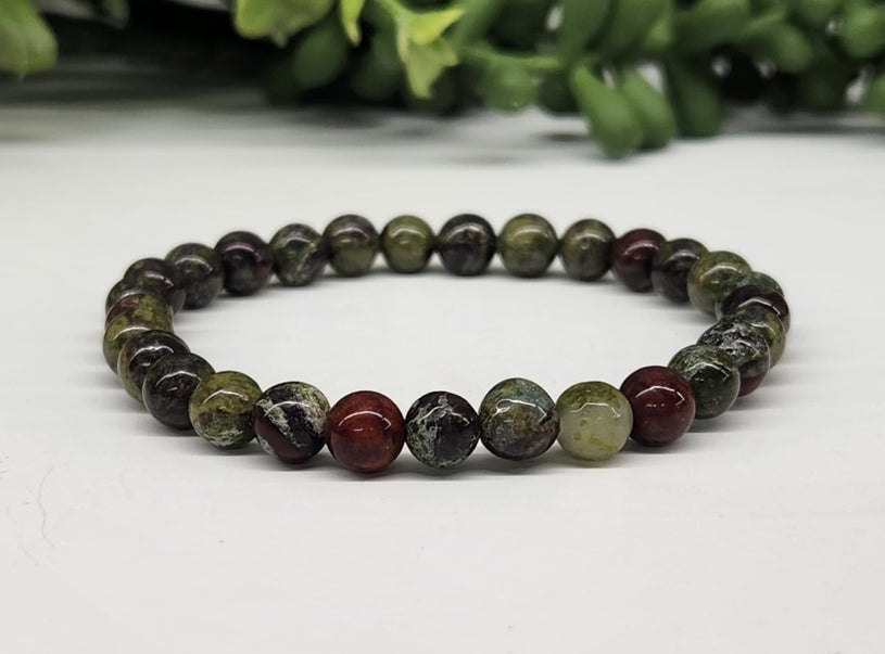 Dragon Bloodstone 6mm Smooth Bead Stretch Bracelet on white background