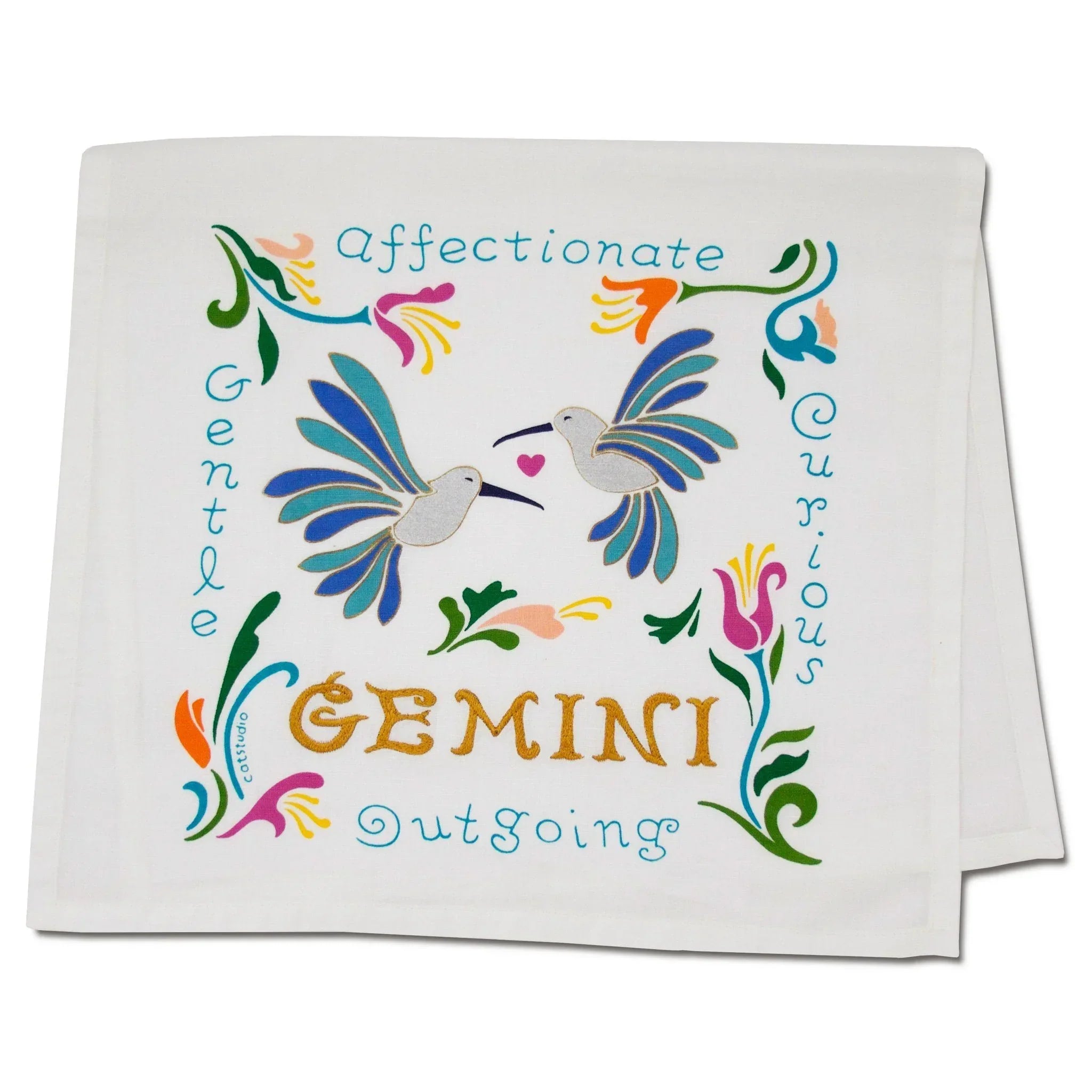 Decorative towel with colorful birds and astrological text on a white background