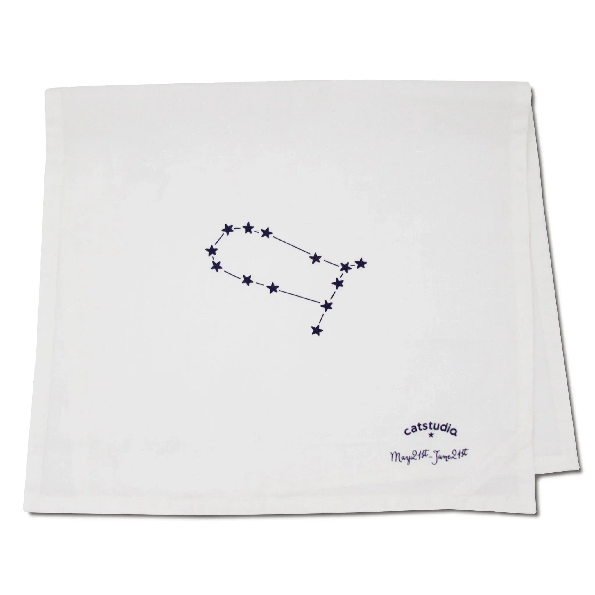 White towel with star constellation design and 'catstudio' branding on a white background
