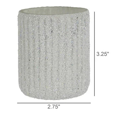 Silver glittery cylindrical candle holder with dimensions labeled on a white background