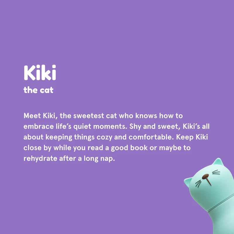 Teal cat-shaped pillow with text about Kiki the cat on a purple background