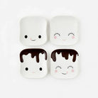 Four marshmallow character saucers with faces on a white background