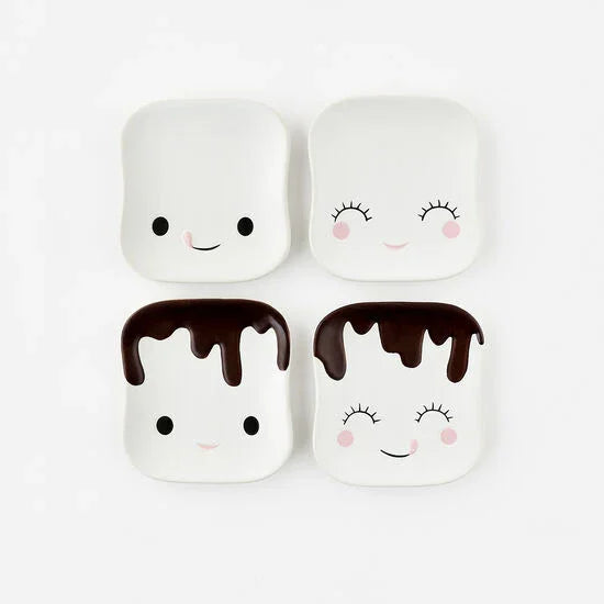 Four marshmallow character saucers with faces on a white background