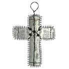 Decorative Milagro Cross with wire wrapping on a white background