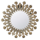 Decorative wall mirror with starburst frame on a white background