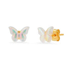 Butterfly-shaped earrings with gold posts on a white background