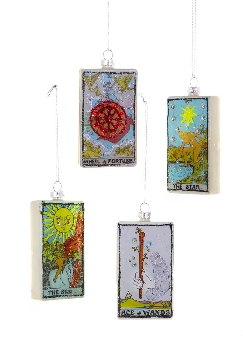 Four tarot card-style ornaments hanging against a white background