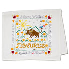 Decorative towel with Taurus zodiac design featuring a bull, sun, and mountains on a white background.