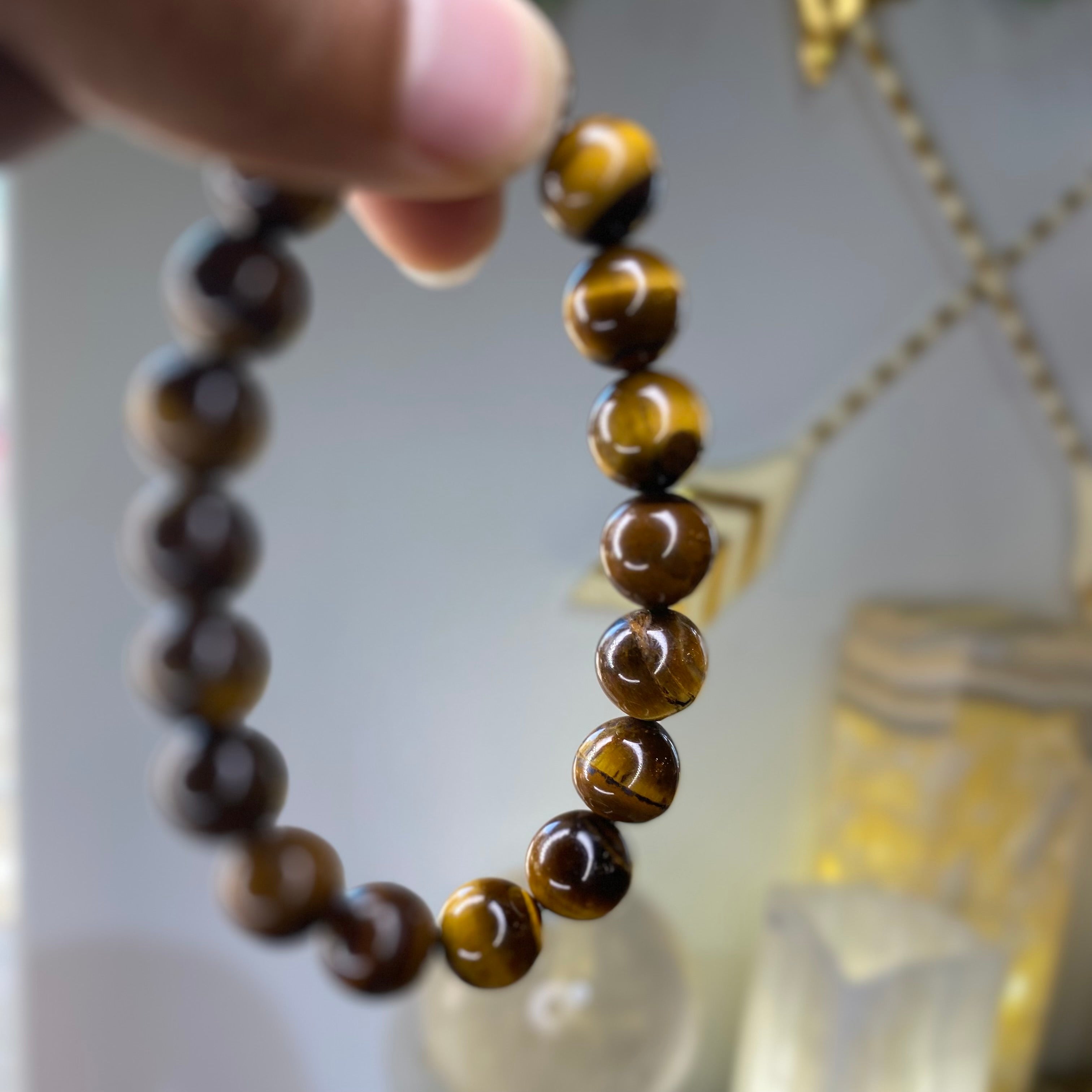 10mm Tiger Eye Bracelet Held by Hand